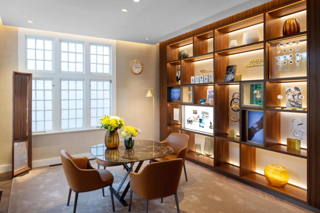 An intimate consultation area in the Rolex boutique Hamptons, reflecting the boutique's design concept of enduring exclusivity through elegant, curated interior elements.